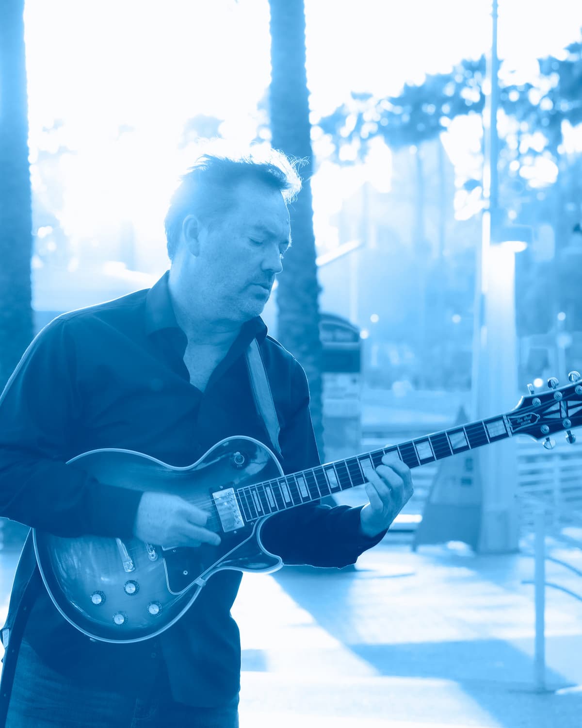 Marcus Gerakos performing live on electric guitar